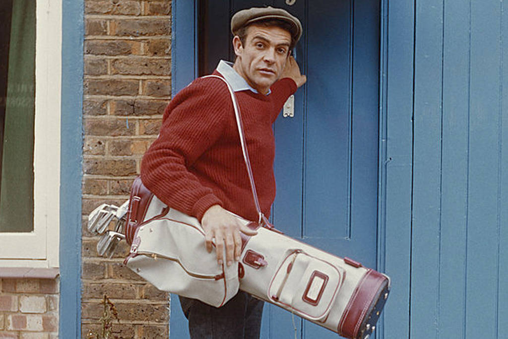 Sean Connery with a set of golf clubs